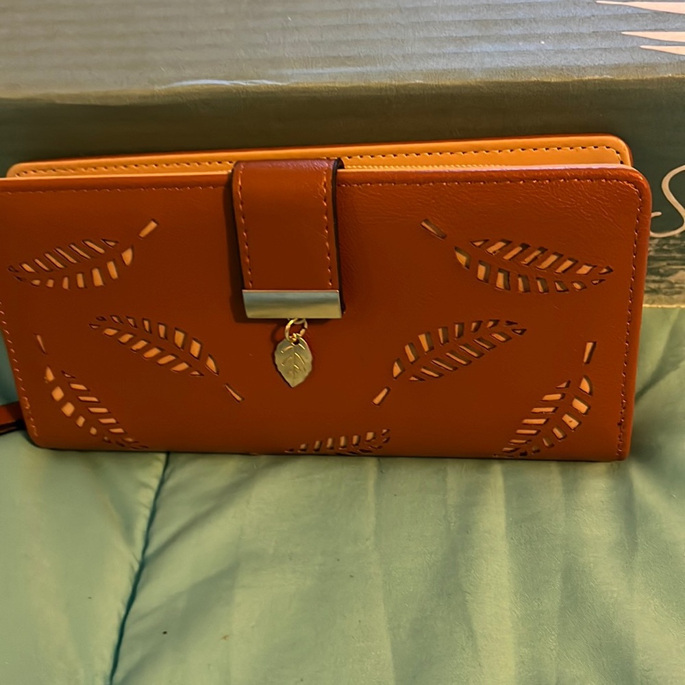 Vagabond Goods Cocoa wallet embossed with leaves.